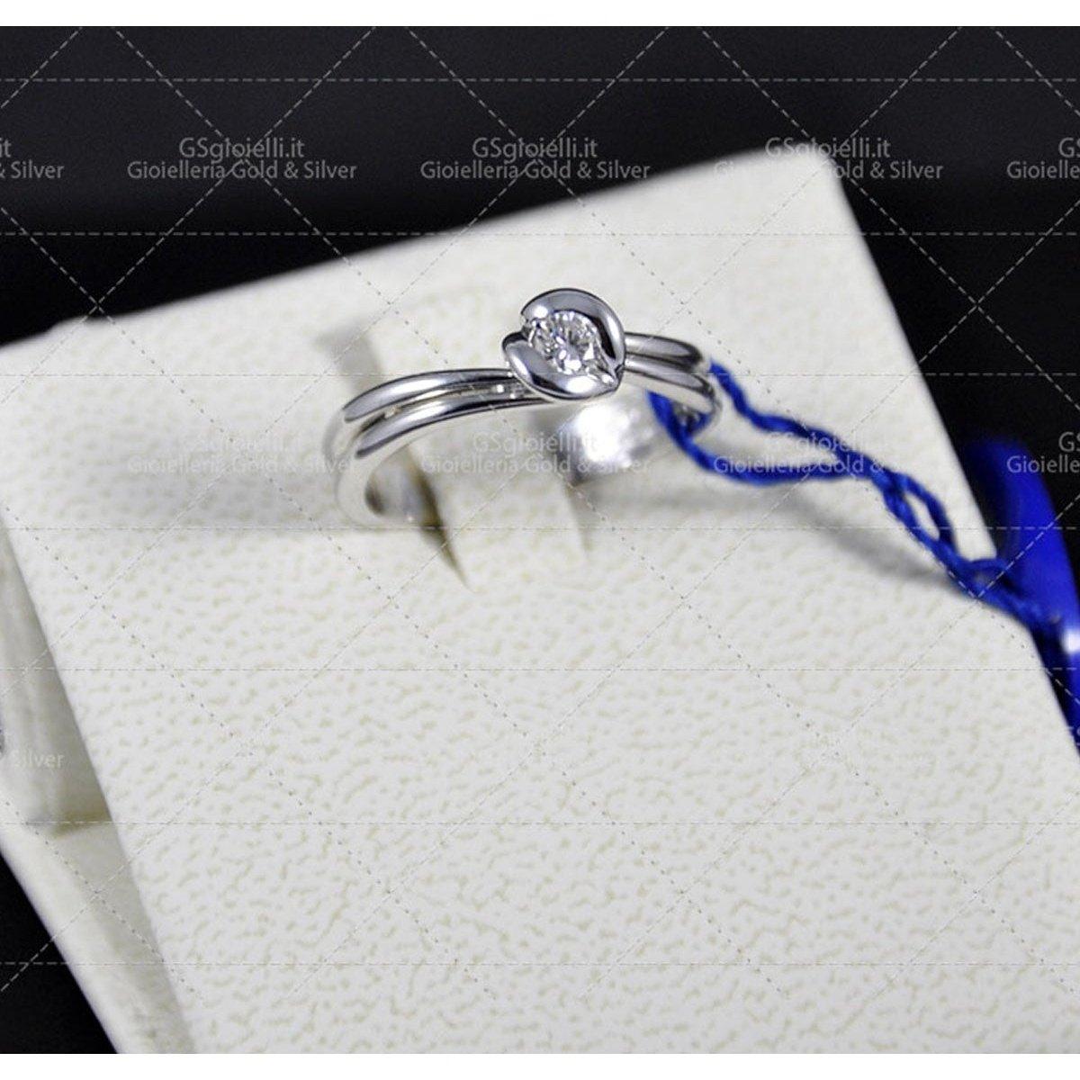 Anello Damiani solitario diamante taglio brillante ct.0.14 colore H if, oro gr.4.80