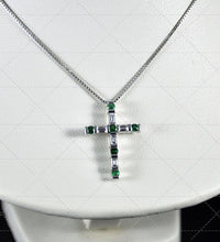 Collana Damiani con croce diamanti taglio baguette ct.0.25 colore H if, smeraldi ct.0.20, oro bianco gr.3.60